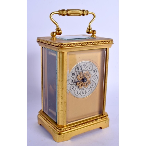 2018 - AN EARLY 20TH CENTURY FRENCH BRASS CARRIAGE CLOCK with silvered dial. 14 cm high inc handle.