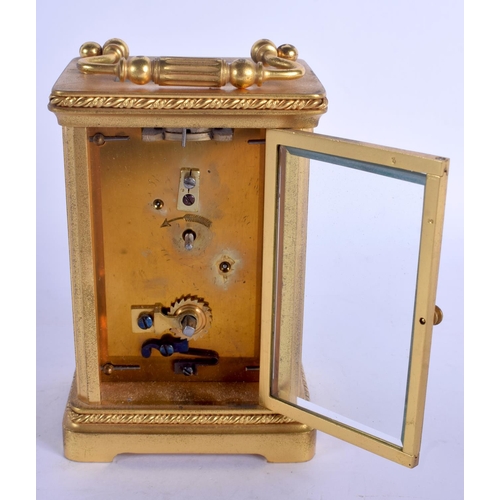 2018 - AN EARLY 20TH CENTURY FRENCH BRASS CARRIAGE CLOCK with silvered dial. 14 cm high inc handle.