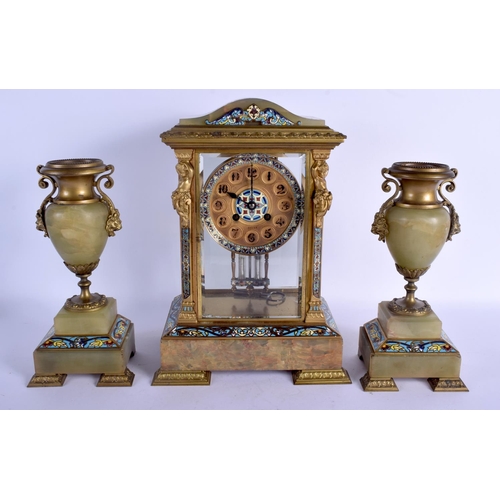 2028 - A LARGE 19TH CENTURY FRENCH CHAMPLEVE ENAMEL CLOCK GARNITURE formed with putti supports. Clock 35 cm... 