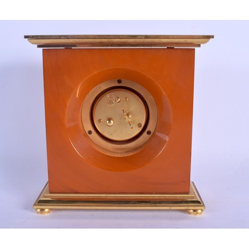 2029 - A RARE 1950S JAEGER LE COULTRE AMBER CATALIN BAKELITE CASED DESK CLOCK with bold brass dial. 15 cm x... 