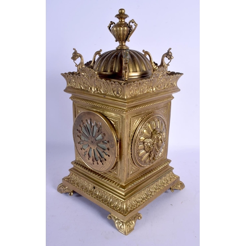 2038 - A 19TH CENTURY FRENCH BRASS MANTEL CLOCK with bold circular dial, within a case decorated with cheru... 