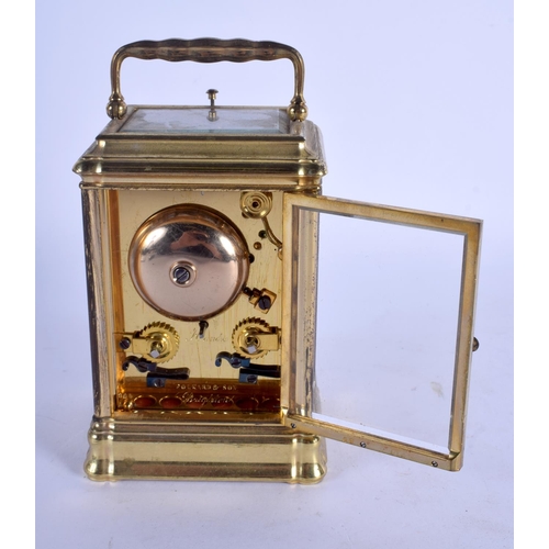 2041 - A SMALL 19TH CENTURY FRENCH BRASS REPEATING CARRIAGE CLOCK with white enamel dial. 13.5 cm inc handl... 