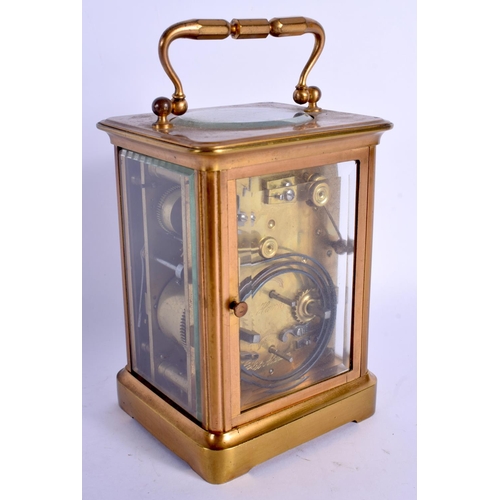 2053 - AN ANTIQUE FRENCH BRASS CARRIAGE CLOCK. 15 cm high inc handle.