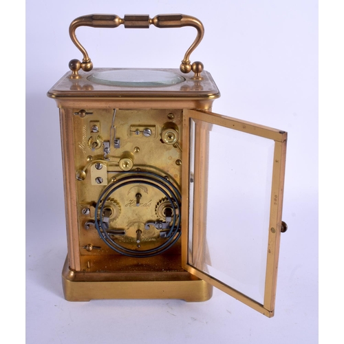 2053 - AN ANTIQUE FRENCH BRASS CARRIAGE CLOCK. 15 cm high inc handle.