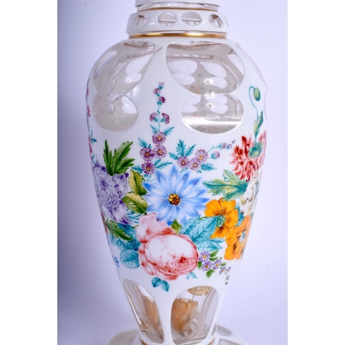 21 - A FINE 19TH CENTURY BOHEMIAN ENAMELLED CLEAR GLASS VASE painted with flowers and trailing vines. 27 ... 