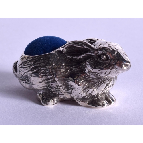 2100 - A SILVER RABBIT PIN CUSHION. 4.5 cm wide.