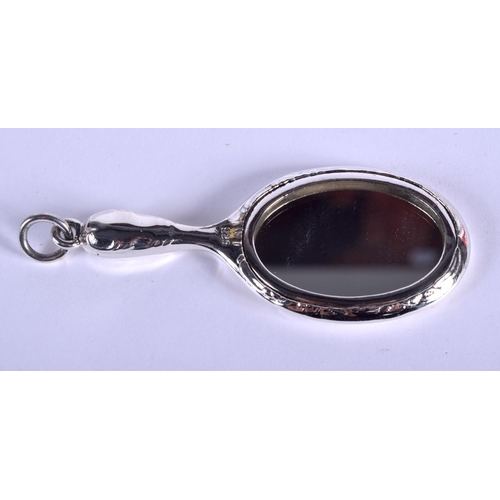 2102 - A MINIATURE SILVER MIRROR. 7.5 cm wide.