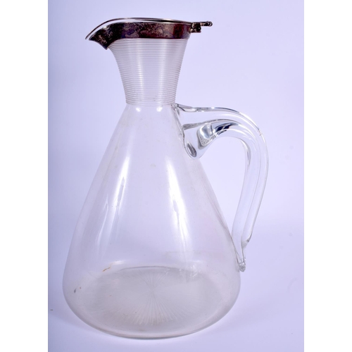 2109 - AN ARTS AND CRAFTS SILVER MOUNTED DECANTER. 21.5 cm high.