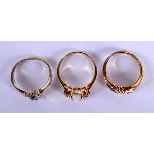 2114 - THREE YELLOW METAL DRESS RINGS. 8.4 grams. (3)