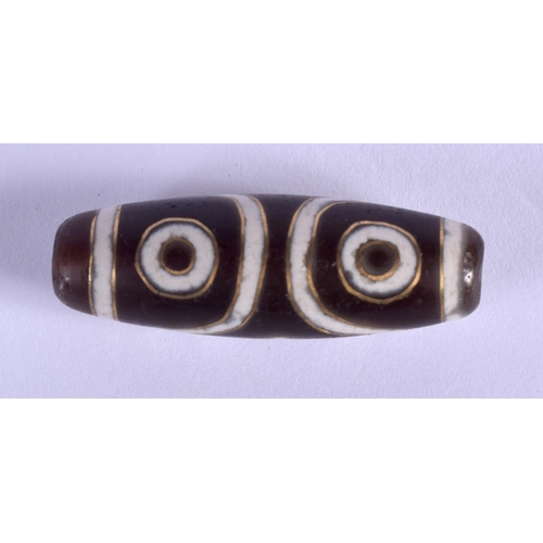 2131 - A CHINESE TIBETAN GOLD INLAID ZHU BEAD. 4 cm wide.