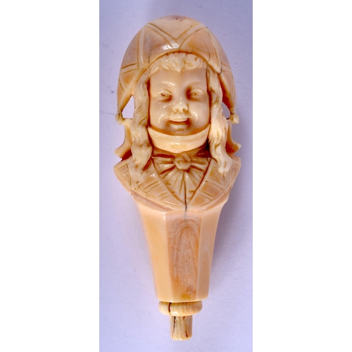 2145 - A 19TH CENTURY FRENCH CARVED IVORY CANE HANDLE modelled as a female wearing a hat. 10 cm x 3.5 cm.