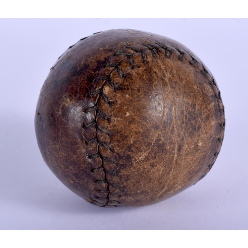 2148 - A VINTAGE BASEBALL. 5.5 cm wide.