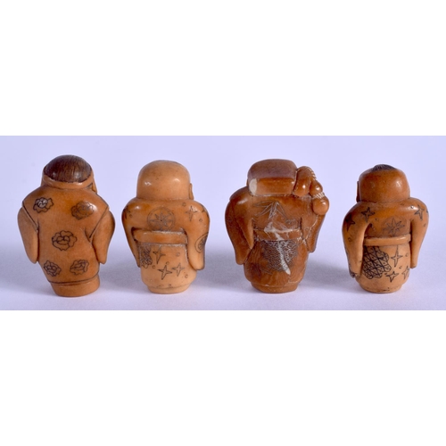 2157 - FOUR JAPANESE CARVED TAGHUA NUT FIGURES. (4)