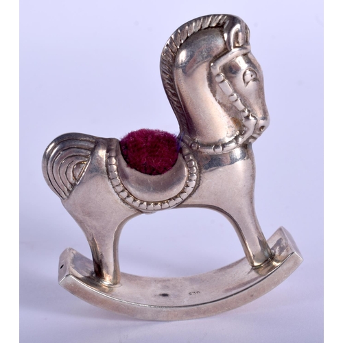 2160 - A SILVER ROCKING HORSE PIN CUSHION. 5 cm x 5 cm.