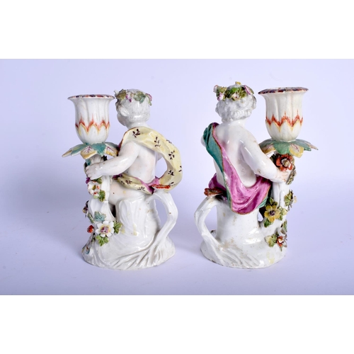 217 - Derby pair of patch mark figures of children holding candle sconces. 16Cm high