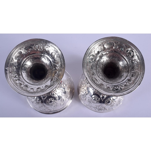 2174 - AN ANTIQUE CONTINENTAL SILVER DOUBLED ENDED STACKING CUPS possibly for wagering, decorated with putt... 