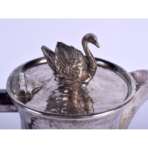 2175 - AN ARTS AND CRAFTS HAMMERED SILVER PLATED SWAN TEAPOT with horn handle. 22.5 cm high.