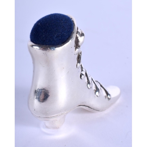 2190 - A SILVER BOOT PIN CUSHION. 4 cm x 3 cm.