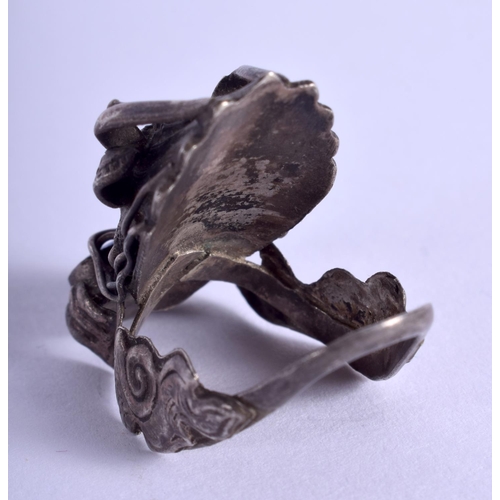 2215 - A CHINESE SILVER DRAGON RING. 2.5 cm wide.