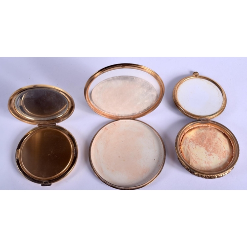 2216 - THREE VINTAGE COMPACTS. 8.5 cm diameter. (3)