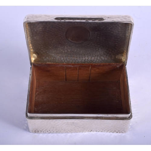 2250 - A HAMMERED SILVER BOX by William Comyns. London 1902. 14 cm wide.