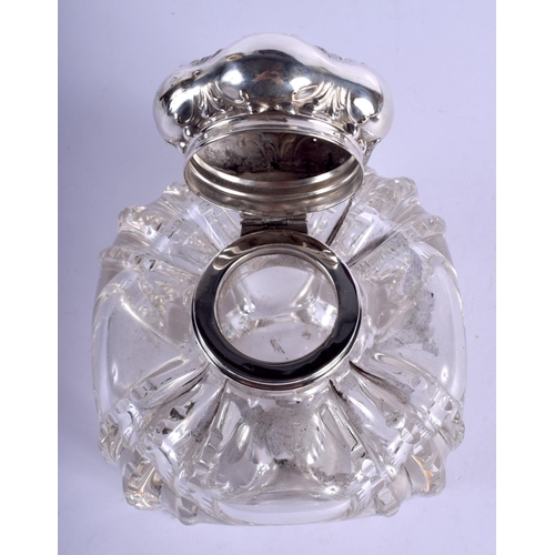 2256 - AN ART NOUVEAU SILVER TOPPED INKWELL. 9 cm wide.