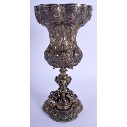 2260 - A 19TH CENTURY CONTINENTAL SILVER PLATED GOBLET decorated with serpents, figures etc. 22 cm high.