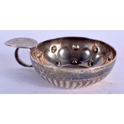 2271 - AN ANTIQUE SILVER WINE TASTER. 66 grams. 10 cm wide.