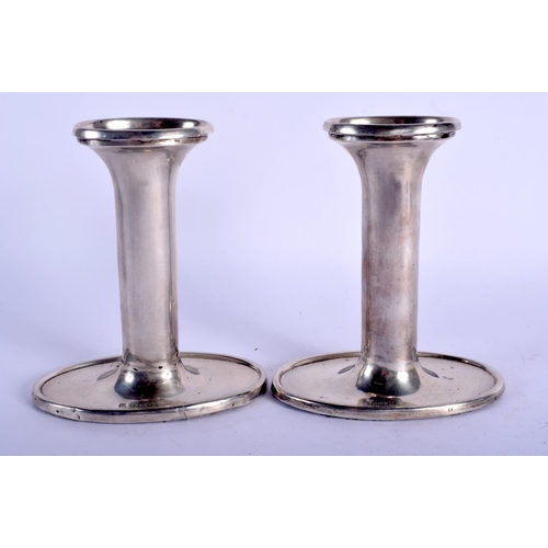 2272 - A PAIR OF SILVER CANDLESTICKS. 490 grams loaded. 13.5 cm high.