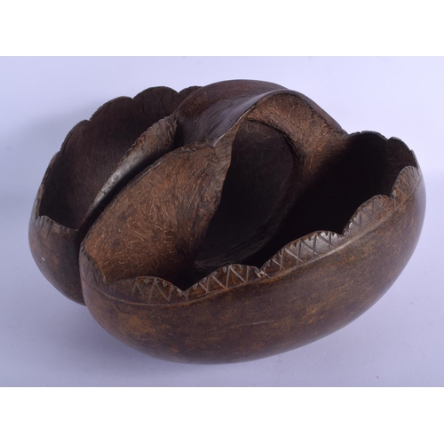 2279 - AN EARLY 20TH CENTURY CONTINENTAL COCO DE MER NUT CARRYING BASKET of naturalistic form. 26 cm x 30 c... 