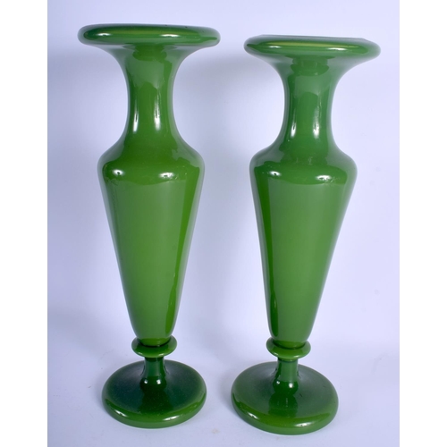 2288 - A LARGE PAIR OF EARLY 20TH CENTURY EUROPEAN OLIVE GREEN GLASS VASES of plain form. 38 cm high.