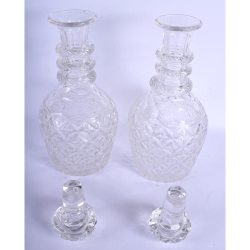 2289 - A LARGE PAIR OF ANTIQUE CRYSTAL GLASS DECANTERS AND STOPPERS. 40 cm high.