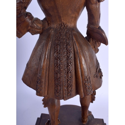 2300 - A LOVELY 19TH CENTURY FRENCH CARVED WOOD FIGURE OF A COMPOSER modelled in robes upon a shaped base. ... 