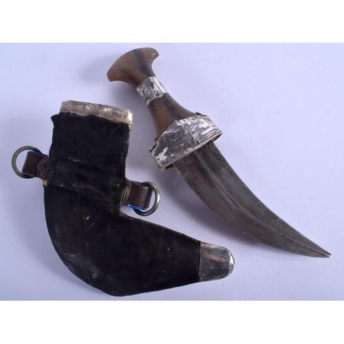 2303 - A 19TH CENTURY MIDDLE EASTERN RHINOCEROS HORN HANDLED SILVER JAMBIYA DAGGER. 28 cm long.