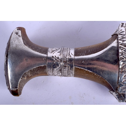 2303 - A 19TH CENTURY MIDDLE EASTERN RHINOCEROS HORN HANDLED SILVER JAMBIYA DAGGER. 28 cm long.