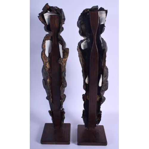 2306 - A RARE PAIR OF 18TH CENTURY EUROPEAN LEATHER FIGURES OF PUTTI modelled upon wood plinths. 50 cm high... 