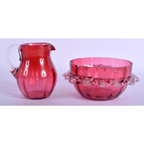 2316 - AN ANTIQUE CRANBERRY GLASS JUG and matching bowl. (2)