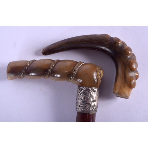 2334 - TWO 19TH CENTURY CONTINENTAL CARVED HORN WALKING CANES possibly Rhinoceros. 85 cm long. (2)