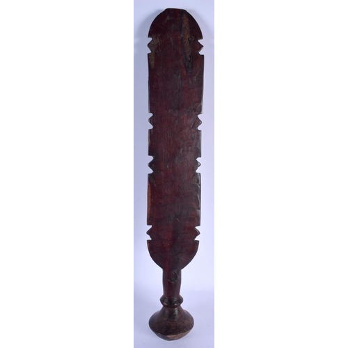 2358 - A LARGE 19TH CENTURY EUROPEAN CARVED WOOD TREEN BEATING PADDLE decorated with motifs. 62 cm long.