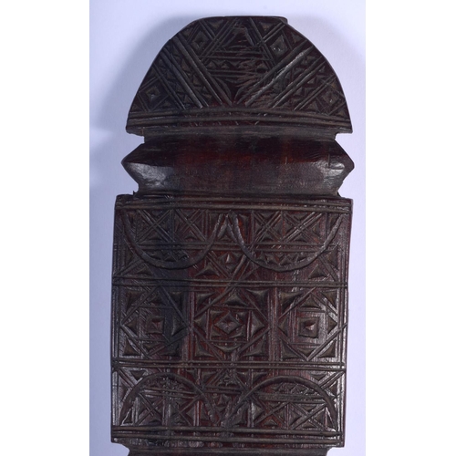 2358 - A LARGE 19TH CENTURY EUROPEAN CARVED WOOD TREEN BEATING PADDLE decorated with motifs. 62 cm long.