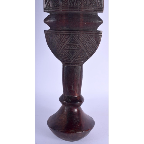 2358 - A LARGE 19TH CENTURY EUROPEAN CARVED WOOD TREEN BEATING PADDLE decorated with motifs. 62 cm long.