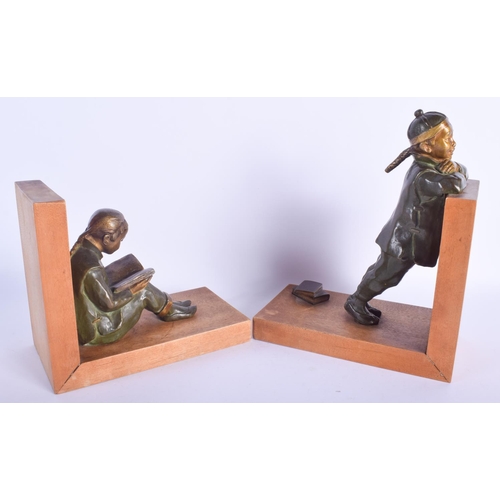 2363 - A LOVELY PAIR OF FRENCH PATINATED BRONZE BOOK ENDS modelled as a standing male and seated female. 24... 