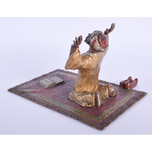 2377 - A 19TH CENTURY AUSTRIAN COLD PAINTED BRONZE FIGURE OF AN ARABIC MALE modelled praying upon a rug. 17... 