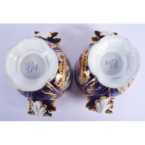 2379 - A PAIR OF 19TH CENTURY FRENCH SEVRES TWIN HANDLED PORCELAIN CACHE POTS painted with armorials and po... 