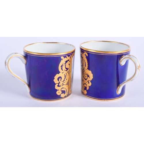 2399 - TWO 19TH CENTURY FRENCH SEVRES PORCELAIN CUPS together with a similar saucer. (3)