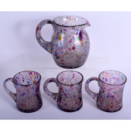 24 - AN UNUSUAL VINTAGE ART GLASS PITCHER with three matching glasses. Largest 16 cm x 12 cm. (4)