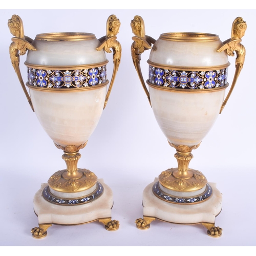 2410 - A LARGE PAIR OF 19TH CENTURY FRENCH CHAMPLEVE ENAMEL AND ORMOLU URNS decorated with bands of foliage... 