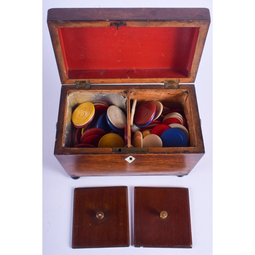 2414 - A GEORGE III MAHOGANY TEA CADDY containing numerous gaming counters. 18 cm x 14 cm.