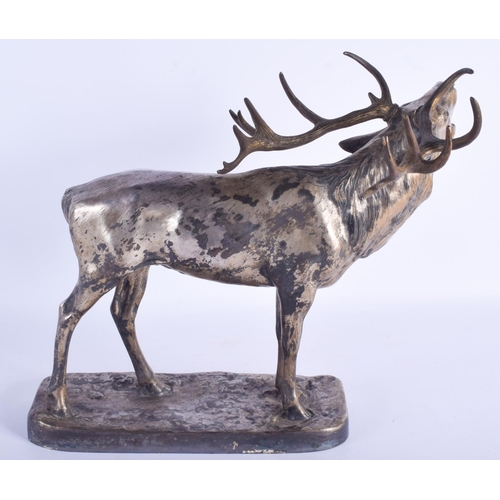 2424 - A LARGE ANTIQUE SILVERED BRASS FIGURE OF A ROAMING STAG modelled upon a rectangular base. 33 cm x 34... 