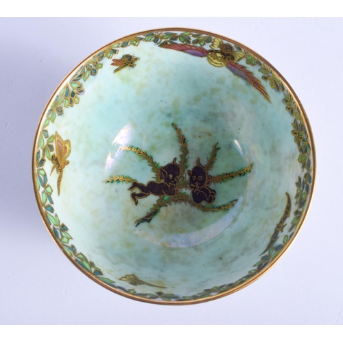 2453 - A WEDGWOOD FAIRYLAND LUSTRE BOWL painted with whimsical figures. 9 cm diameter.